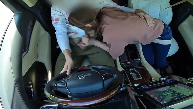 Married Asian MILF enjoys a surprise blowjob in her car